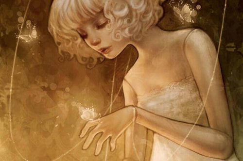 Kvinde der kigger paa et lys