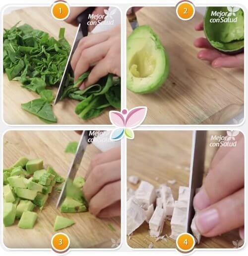Person der hakker spinat og advokado