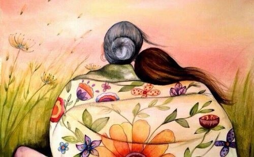 Aeldre kvinde der sidder med en yngre