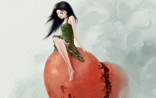 Pige der sidder paa en knust hjerte