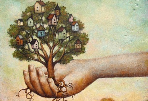 haand der holder et trae med huse