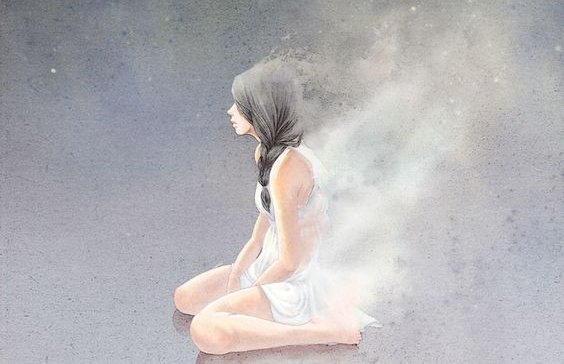 Kvinde der sidder paa knaene